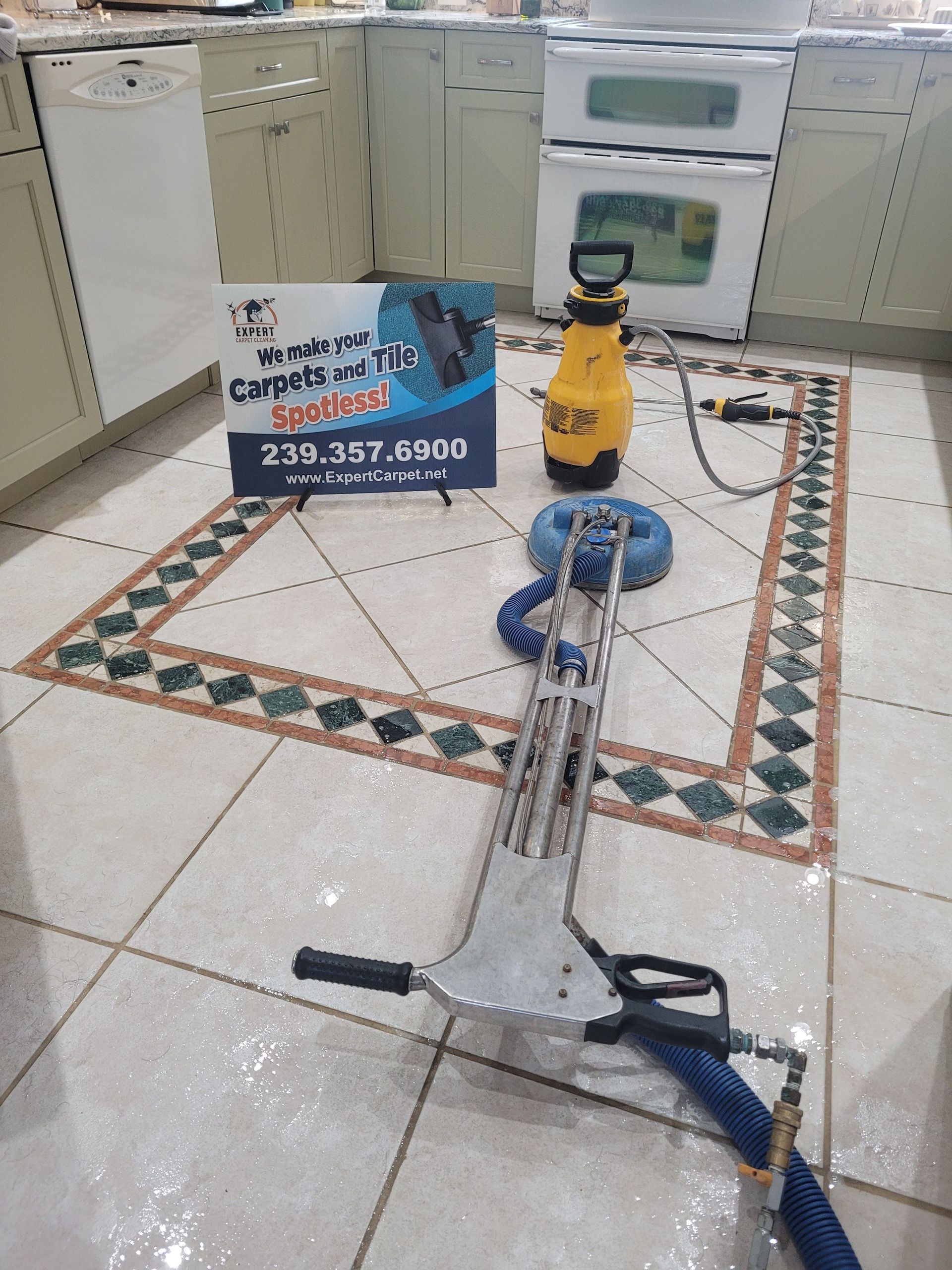 Corded floor grinder on tiled floor in a showroom, with cabinets and a product sign in the background.