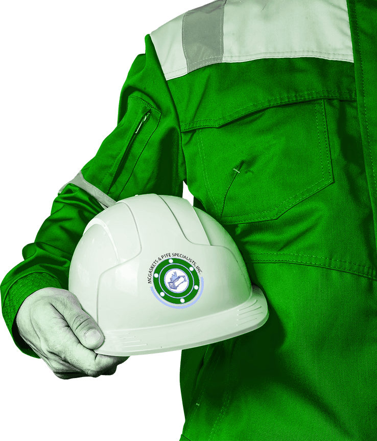 Worker in green uniform holding a white hard hat with a logo.