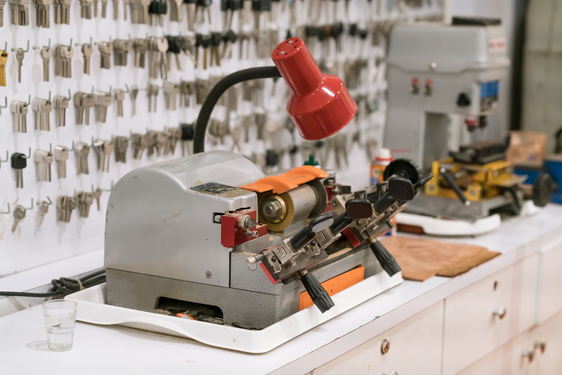 :ocksmith tools used for key duplication and custom order creation.