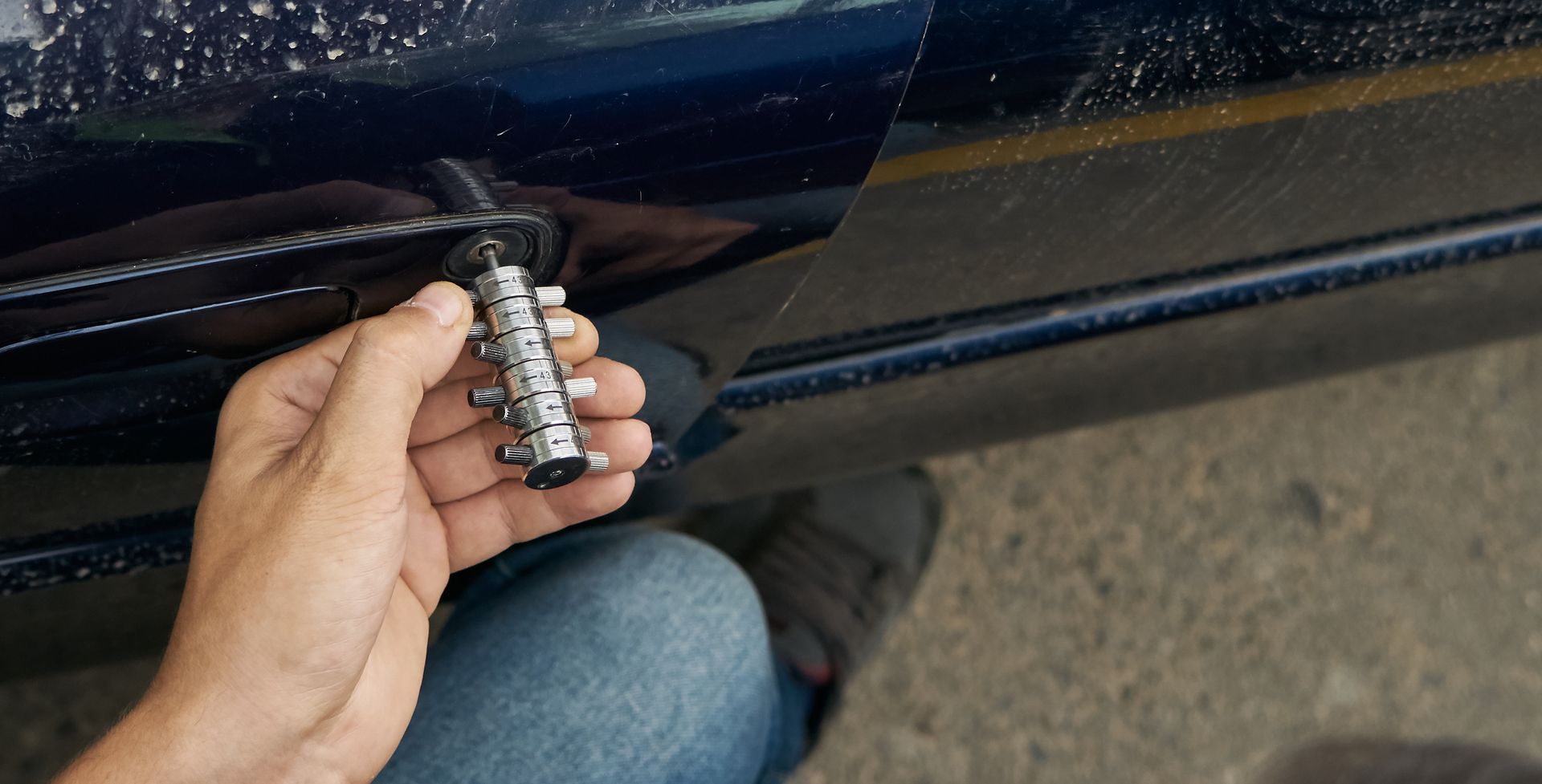 Expert locksmith swiftly resolving an emergency lockout situation, skillfully unlocking a vehicle door with specialized tools and techniques. Expert locksmith swiftly resolving an emergency lockout situation, skillfully unlocking a vehicle door with specialized tools and techniques.