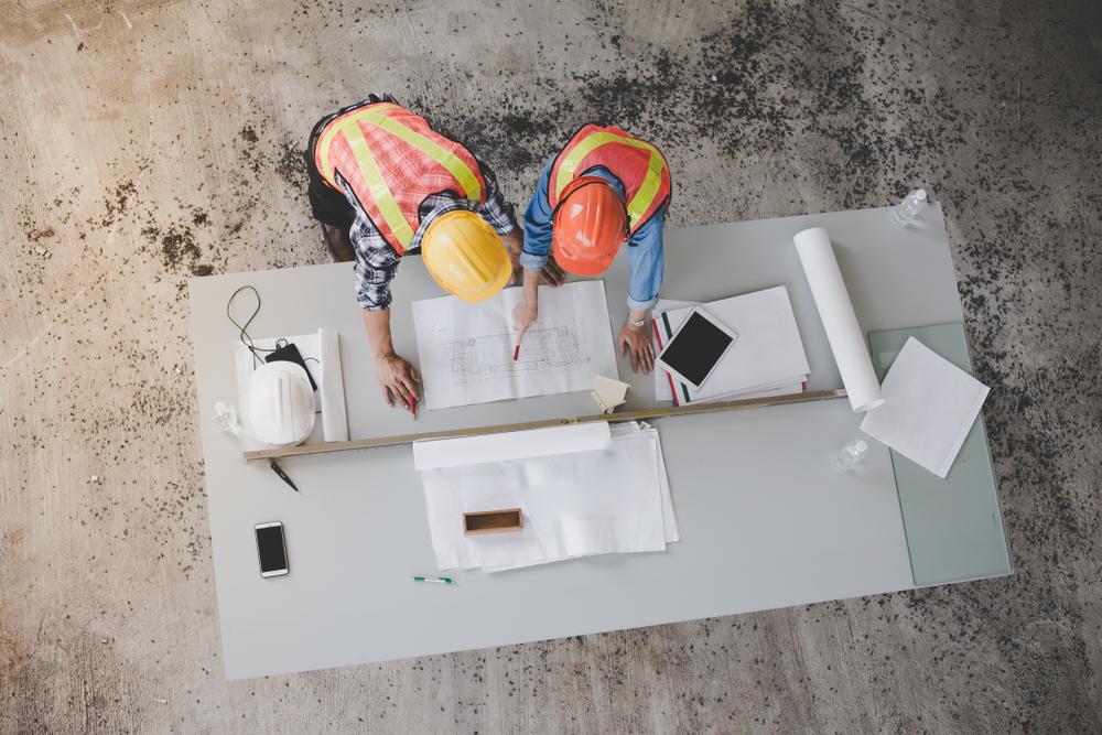 Two Engineers Looking At House Plans — Quality Constructions in Maryborough, QLD