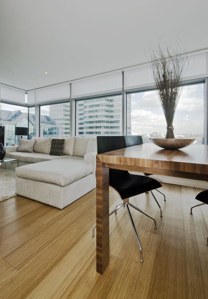 Couch And Dining Table In The Living Room — Quality Constructions in Hervey Bay, QLD