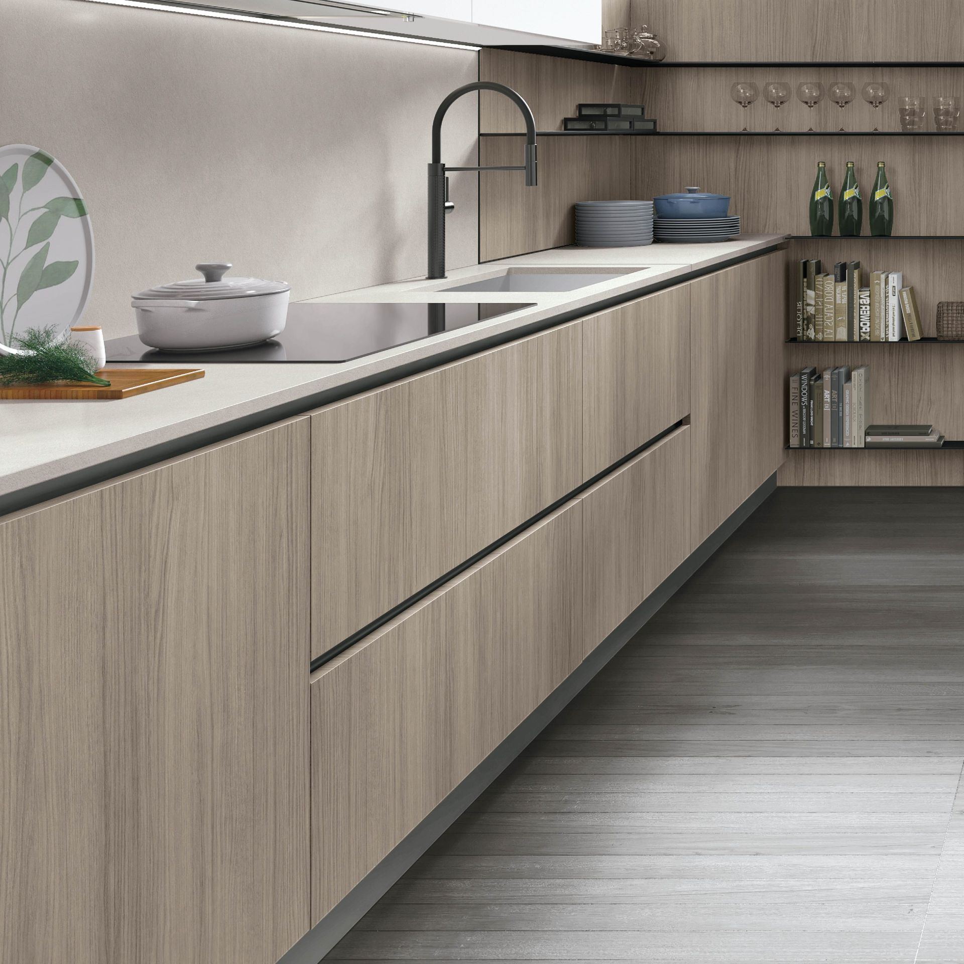 Cucina moderna con mobili in legno chiaro, lavello in acciaio inox e ripiani a vista.