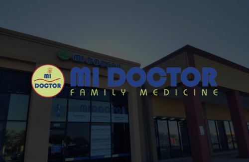 A sign for mi doctor family medicine is on the side of a building