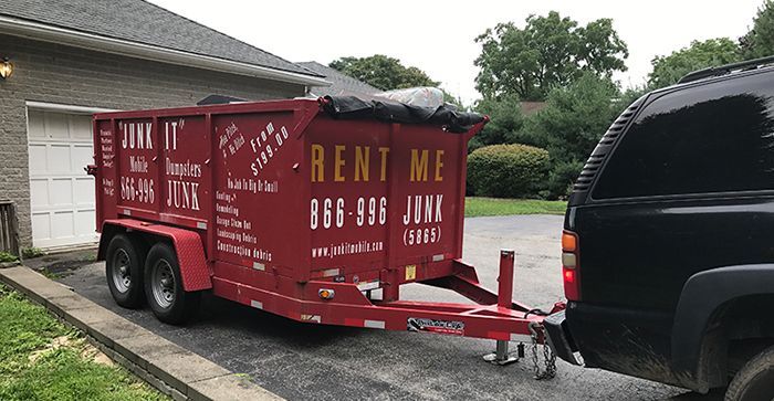 Dumpster Toed with Car — Poughkeepsie, NY — Junk It Mobile Dumpsters