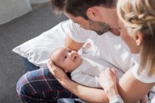 Couple taking care of their child