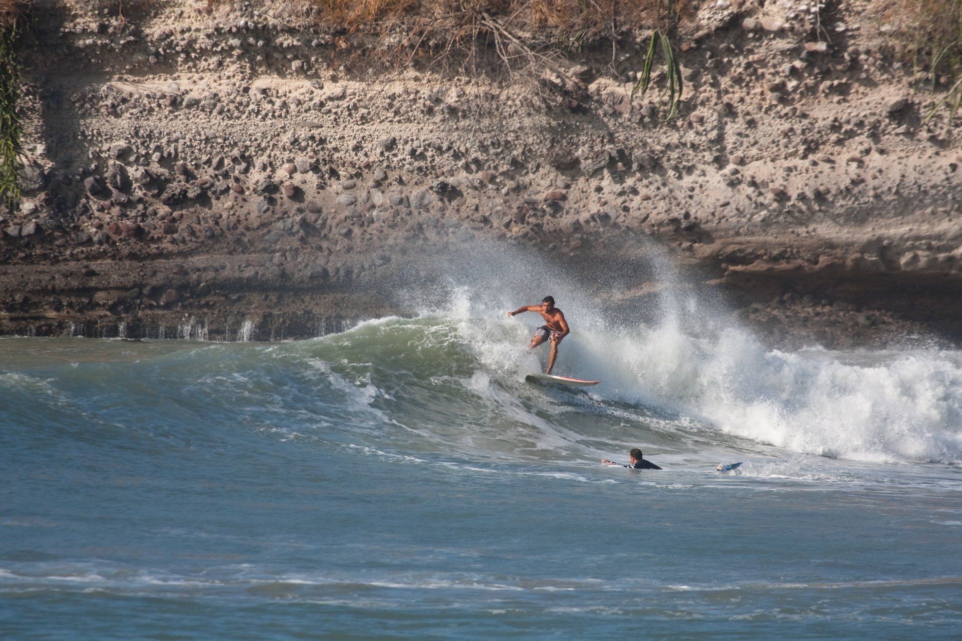 Surfer riding waves at El Palmar Beach Panama