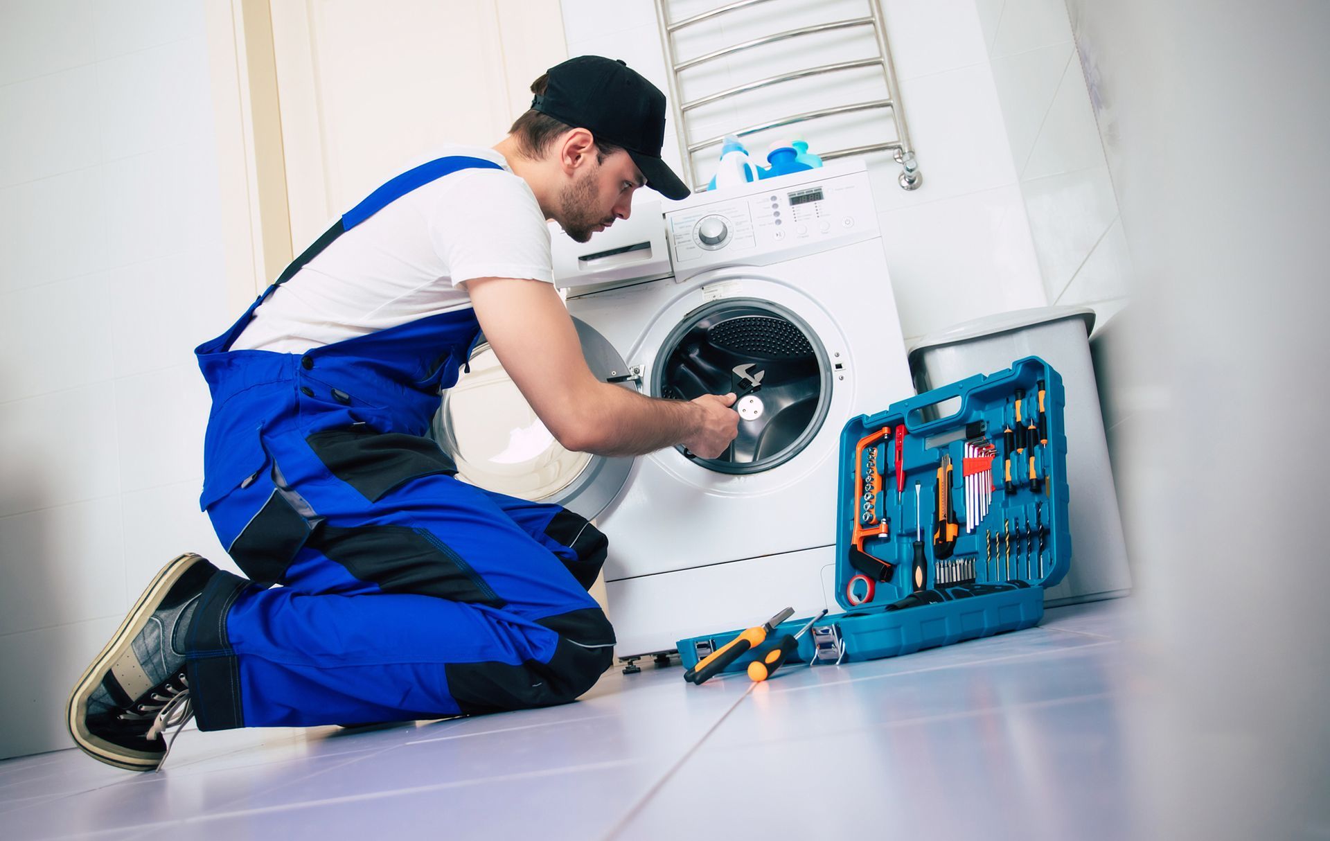 Man Fixing Washer — Washington, NC — Mayo Appliance Solutions