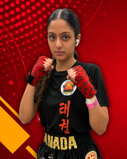 Martial artist posing with raised fists in black and red uniform against a red graphic background