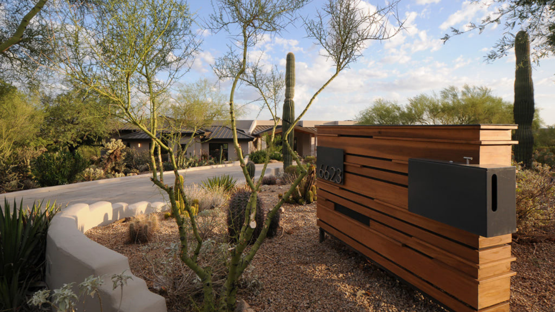 An Arizona house by Collective Construction surrounded by trees.