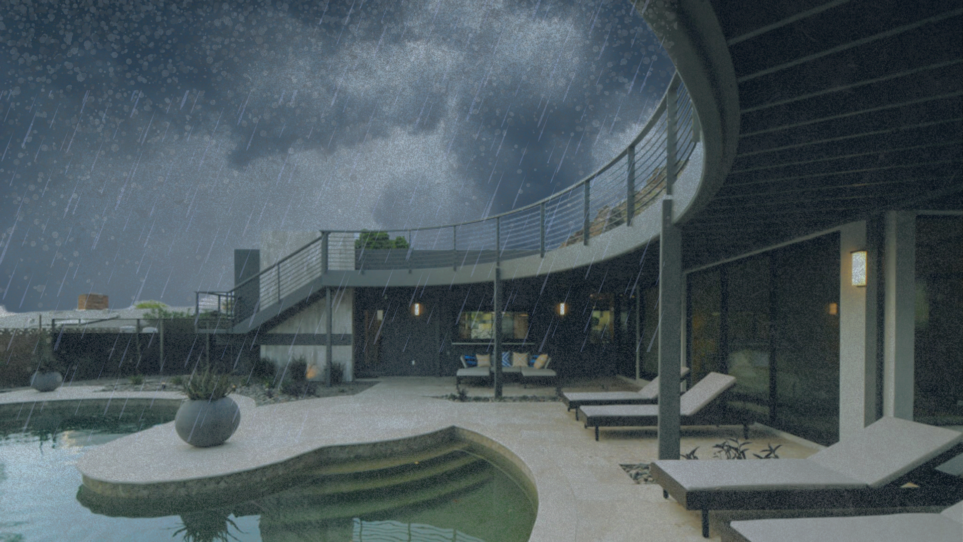 A house with a swimming pool and chairs in the rain.