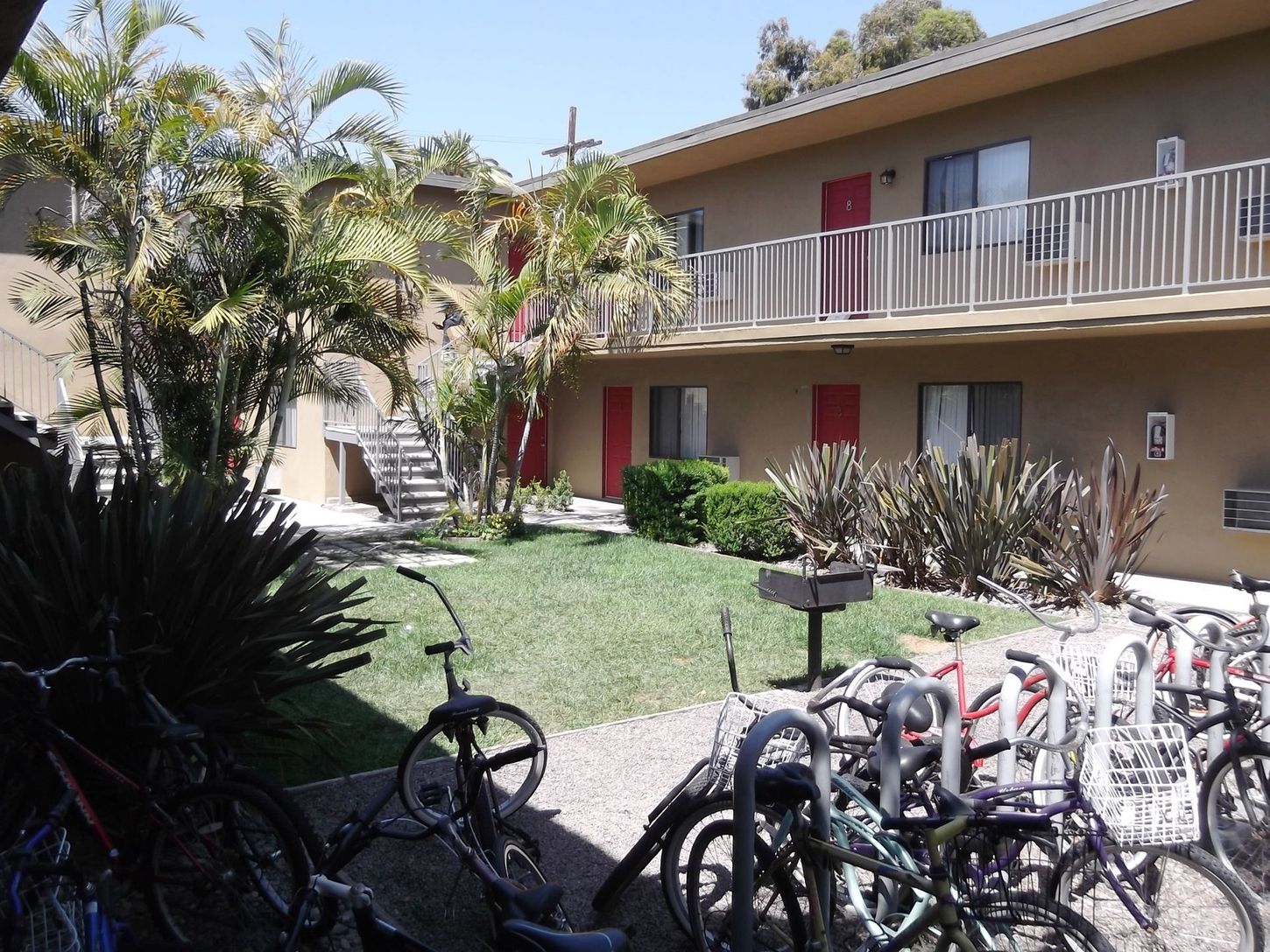 A bunch of bikes are parked in front of a building
