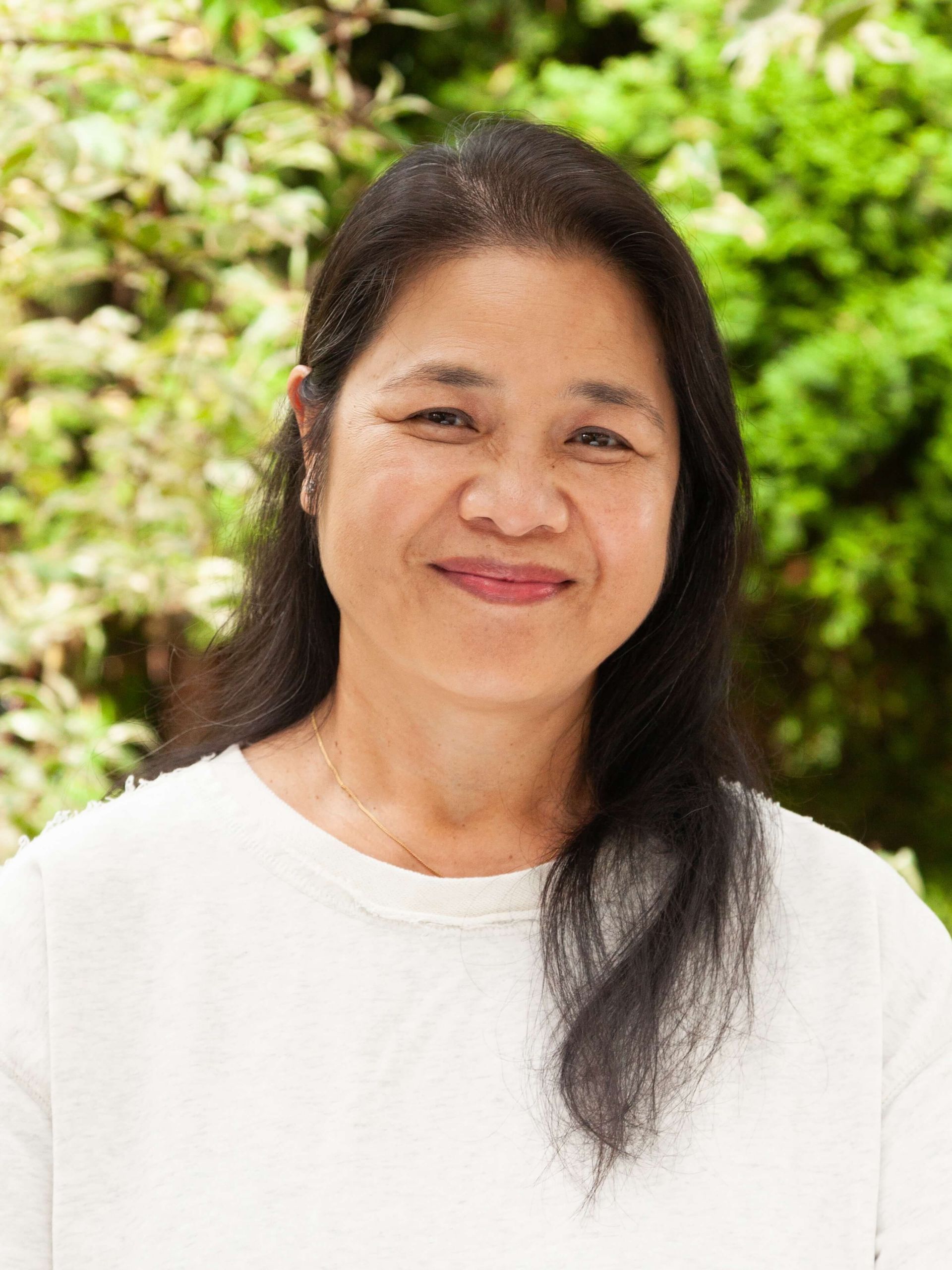 A woman gently smiling