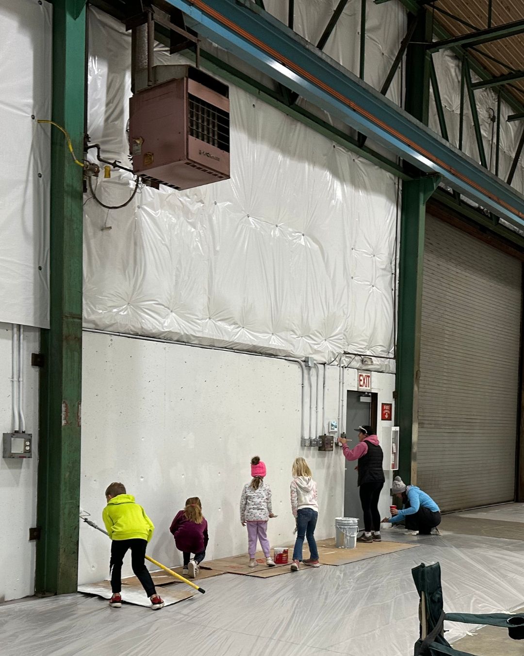 Families helping get the new gym ready