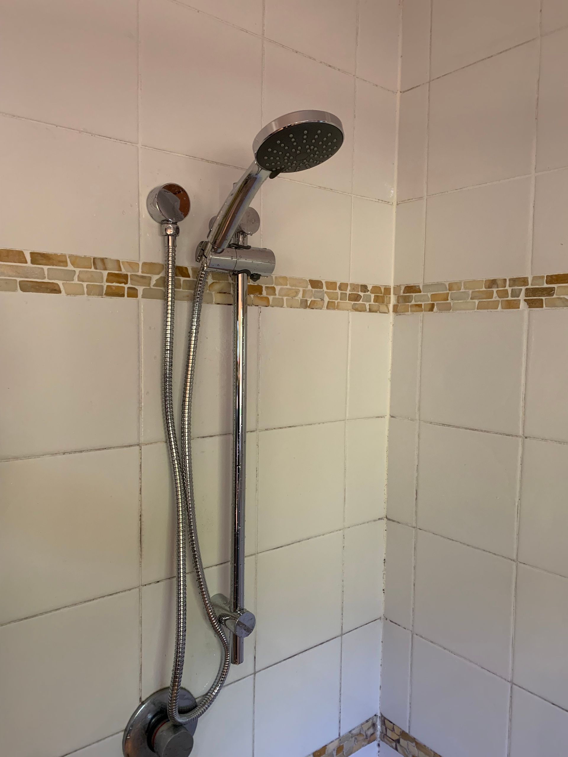 a leaky pipe splashing water on a muddy surface outside — Delaney Plumbing Services In Taree, NSW