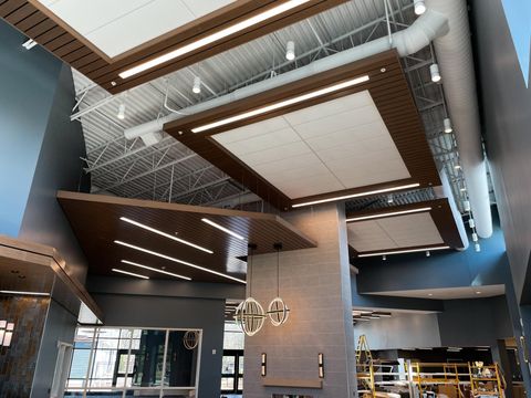 The ceiling of the community space with a variety of lights