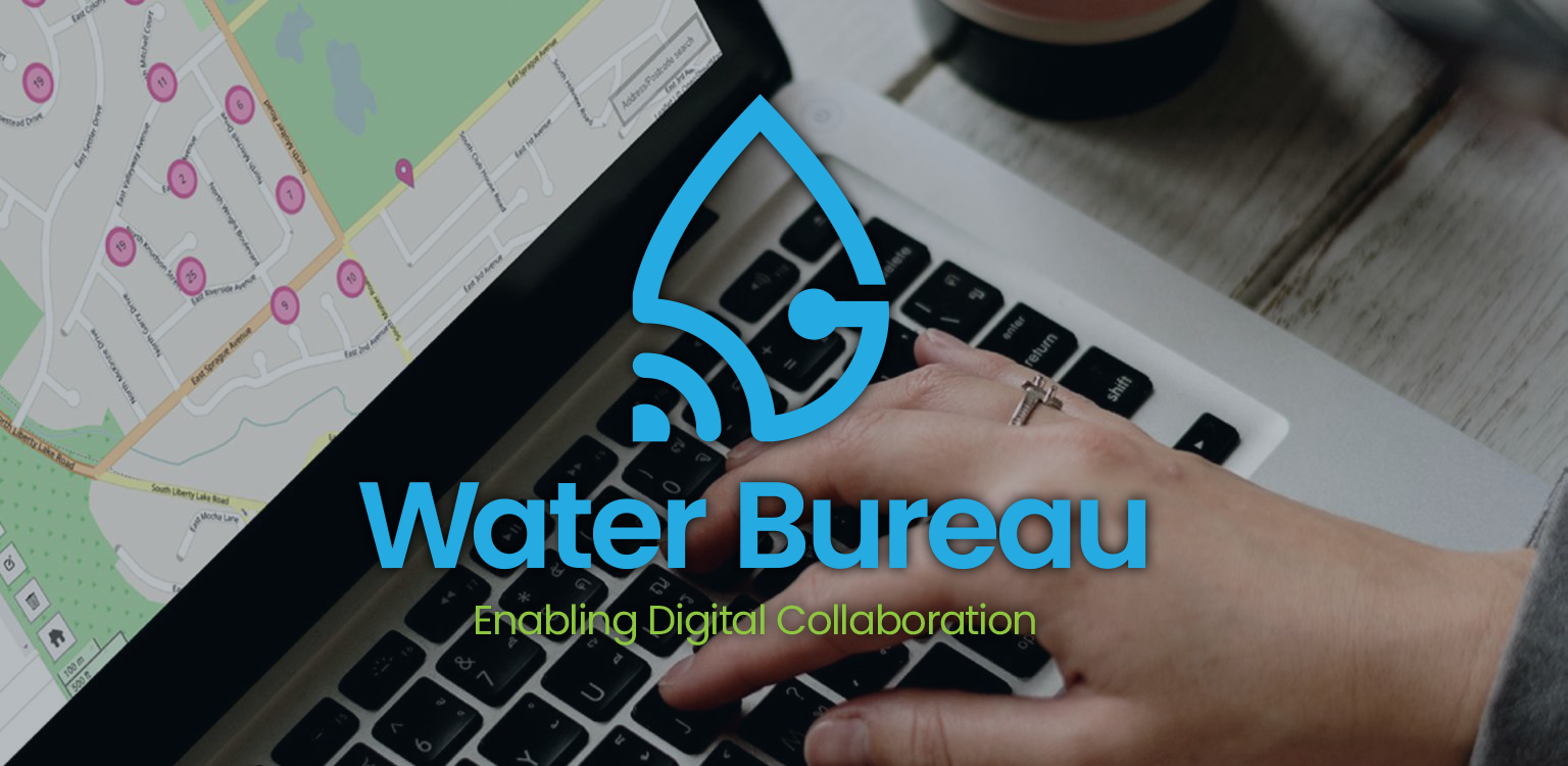 Water Bureau logo over a laptop and hand writing on paper in an office setting