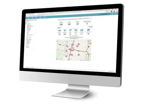 Desktop computer displaying a mapping or analytics dashboard on a white screen