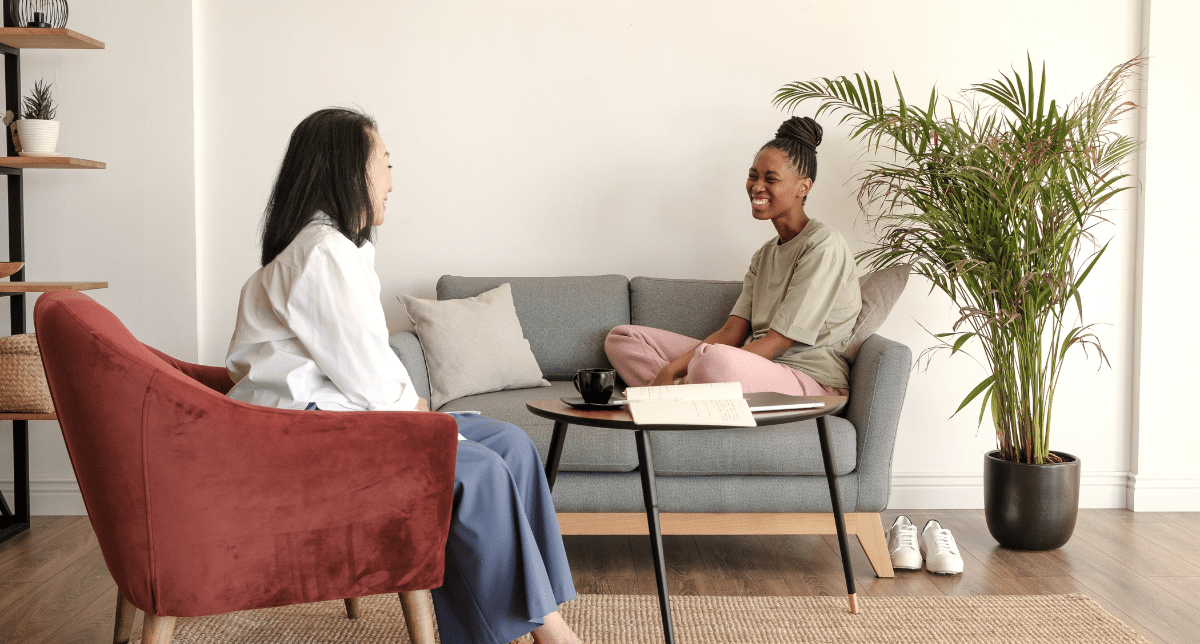 therapy session with client sitting relaxed on sofa