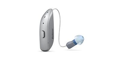 A close up of a hearing aid on a white background.