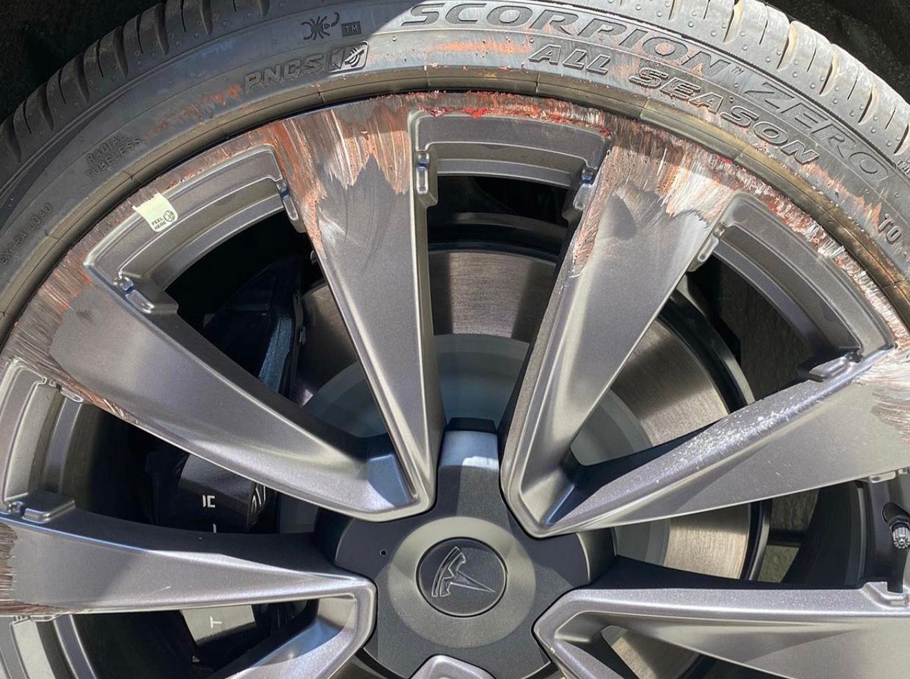 A close up of a car wheel with a tire on it.