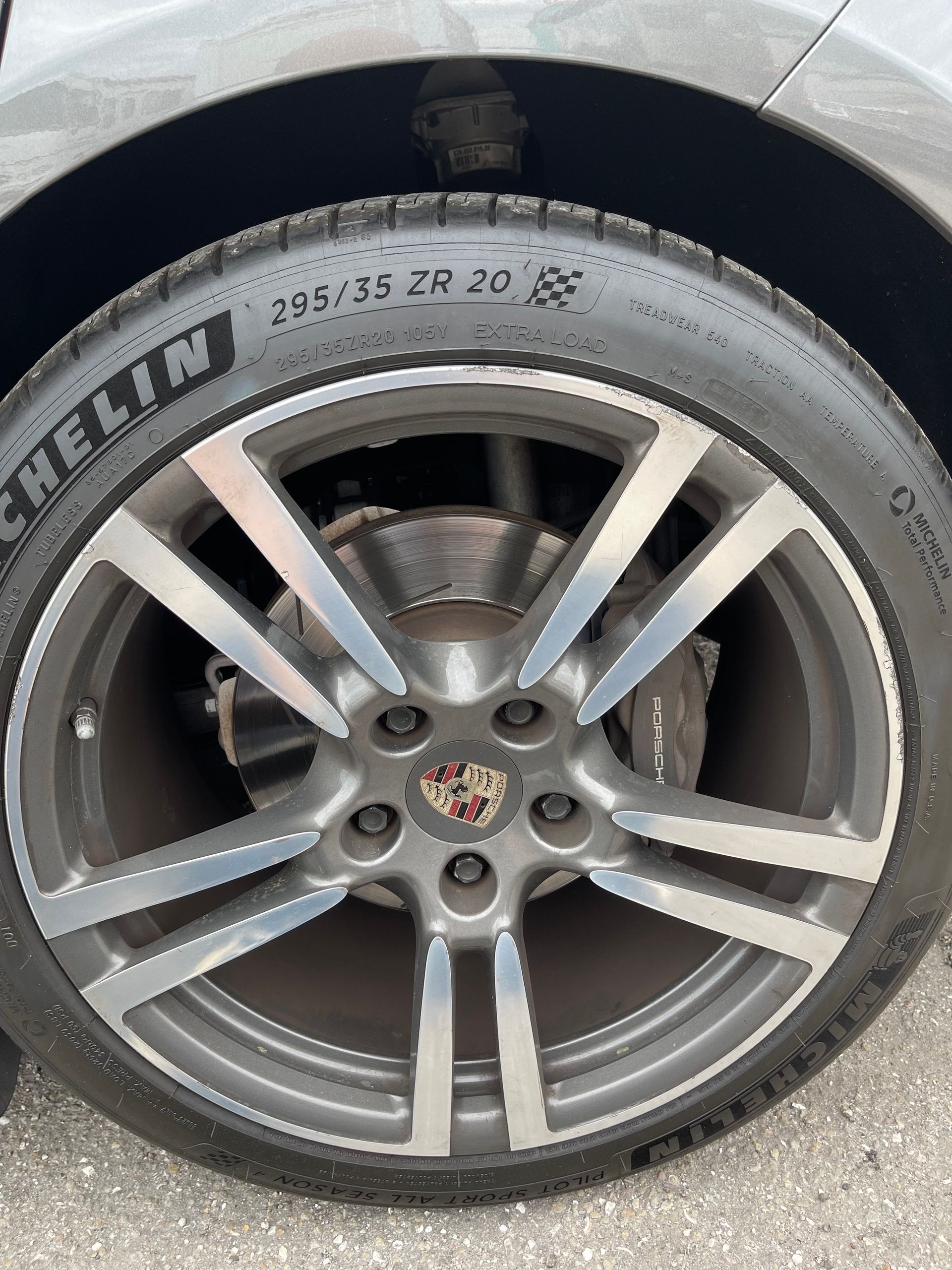 A close up of a car wheel with a michelin tire on it.