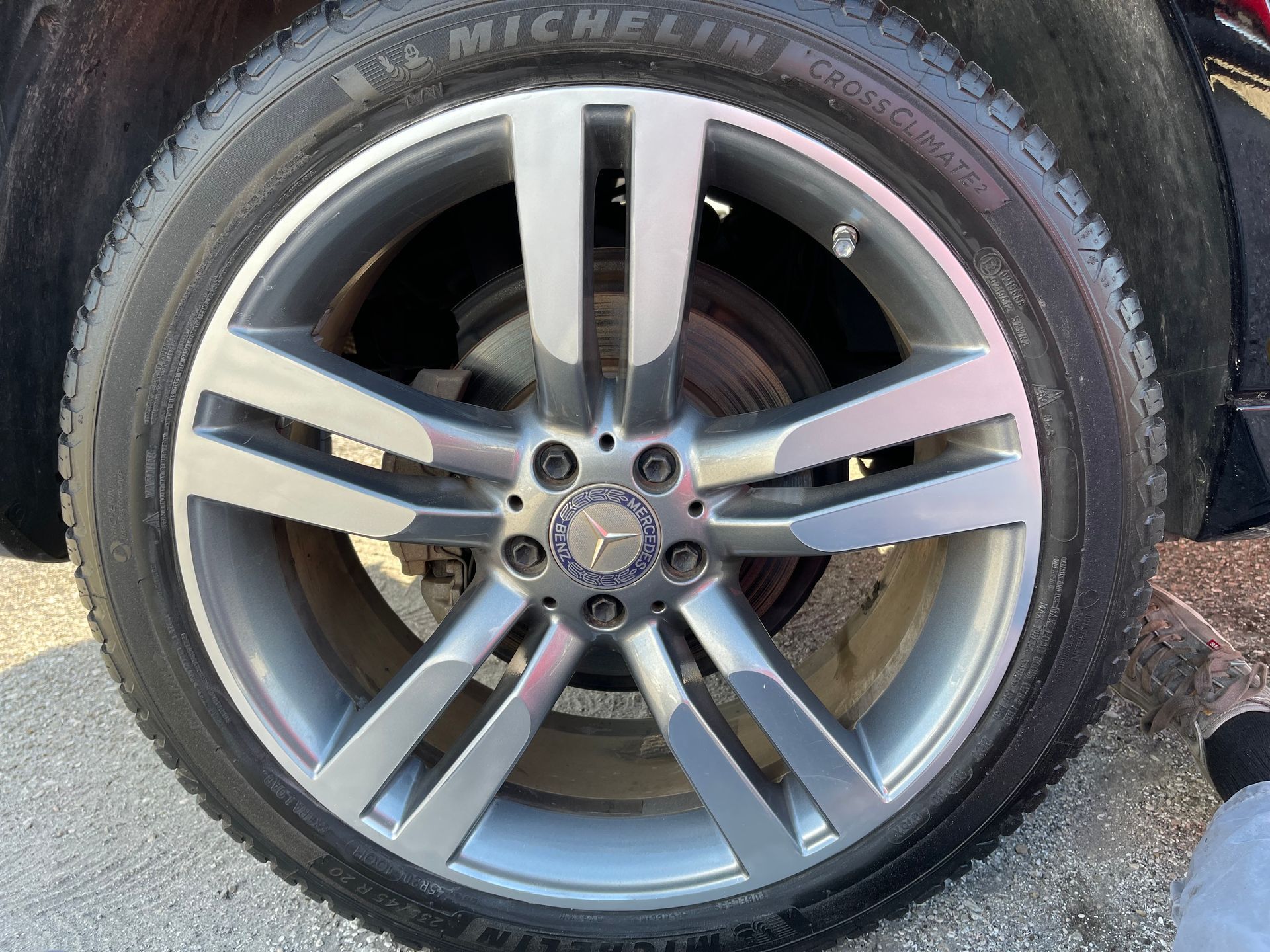 A close up of a car wheel with a michelin tire on it