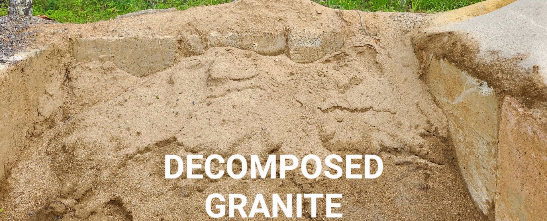 A Pile of Decomposed Granite is Sitting on Top of a Pile of Sand — T&G Sand and Gravel In Sippy Downs, QLD