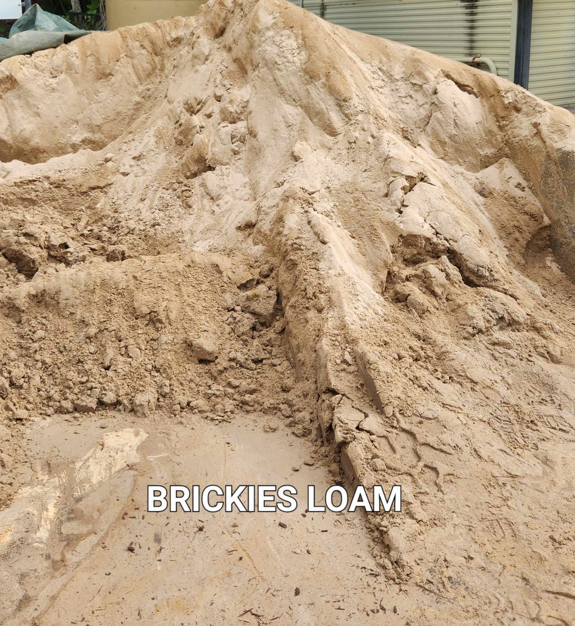 A Pile of Brickies Loam is Sitting on Top of a Pile of Dirt — T&G Sand and Gravel In Sippy Downs, QLD