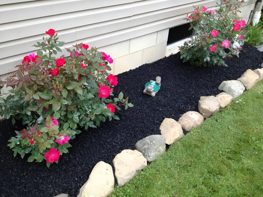 A Garden With Flowers And Rocks In Front Of A House — T&G Sand and Gravel In Buderim, QLD