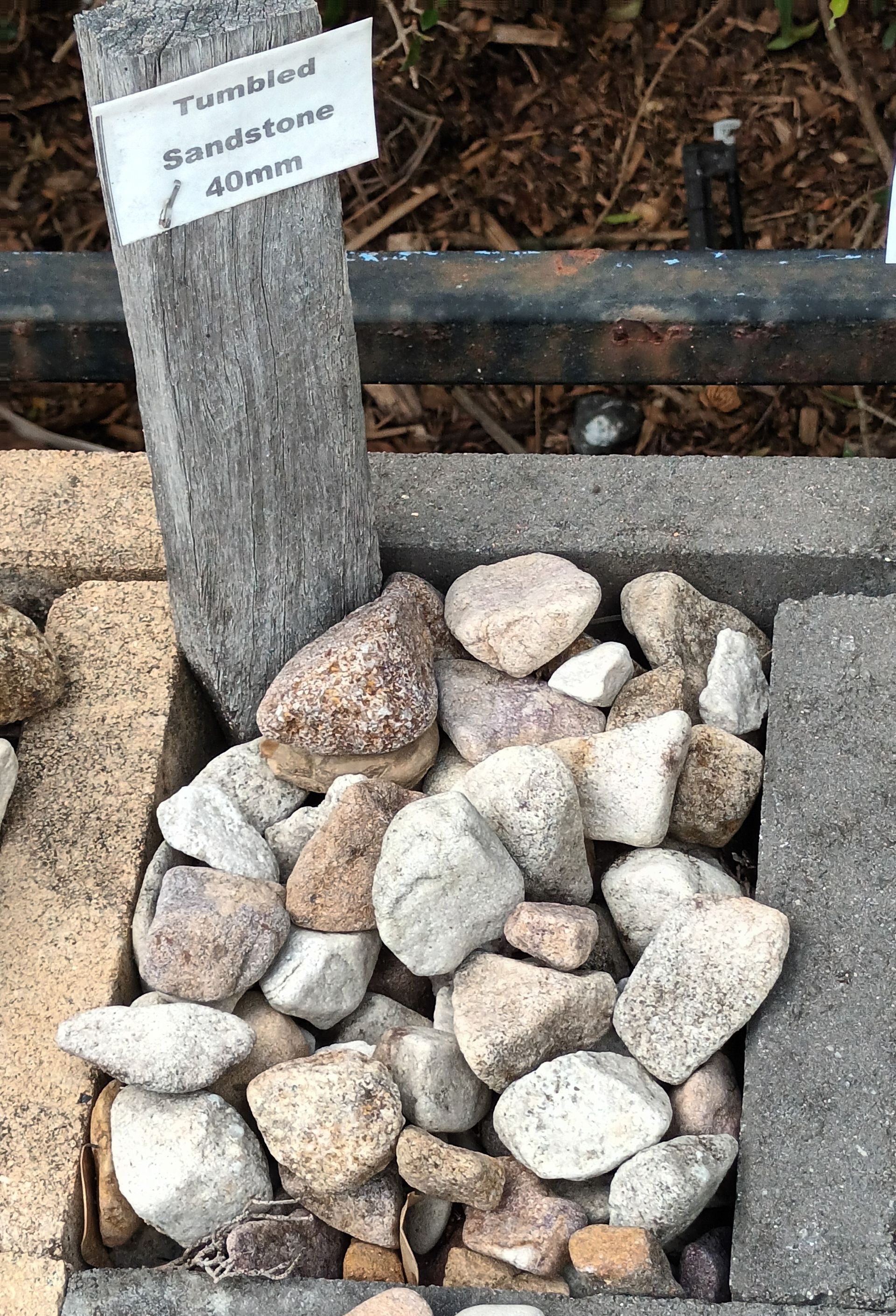 A Pile of Tumbled Sandstone 40mm Stones— T&G Sand and Gravel In Sippy Downs, QLD