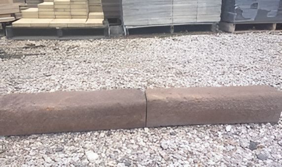 A Brick Is Sitting On Top Of A Pile Of Gravel — T&G Sand and Gravel In Sippy Downs, QLD