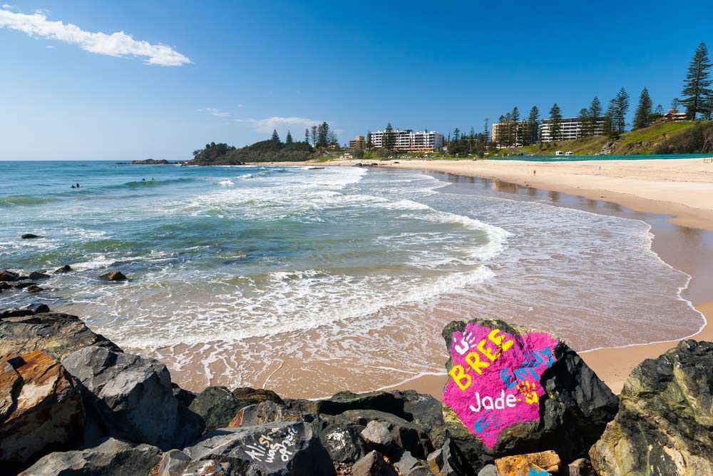 A Beach With A Pink Rock That Says Bride Jade On It — Dillon Rural In Port Macquarie, NSW