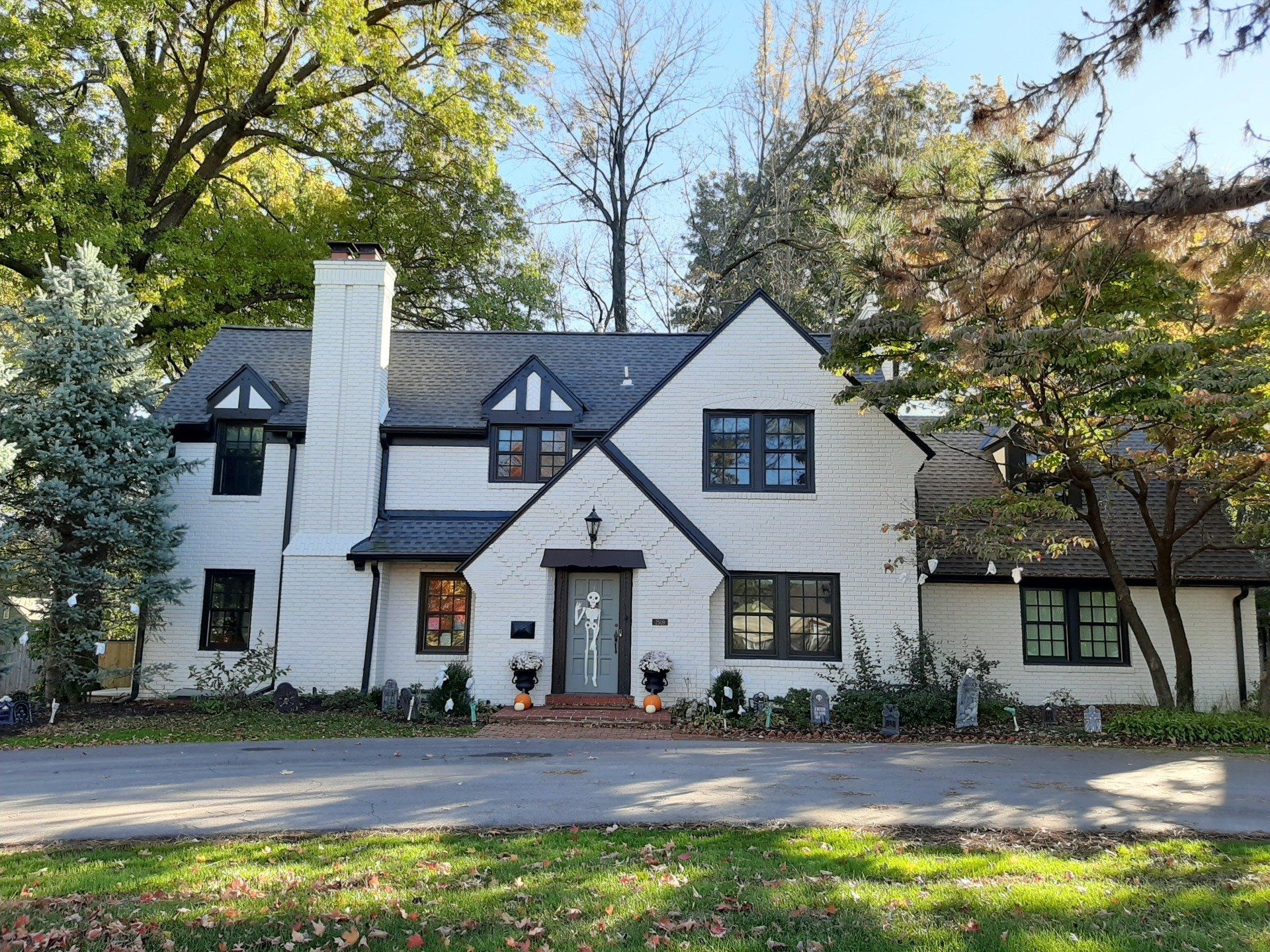 brick house painted white by Home Pros
