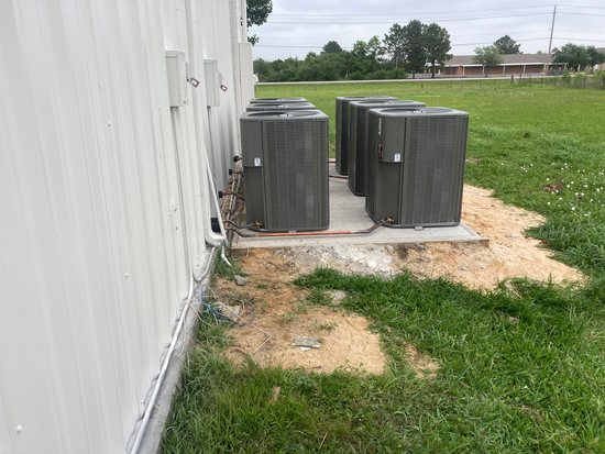 Technician diagnosing an air conditioning system.
