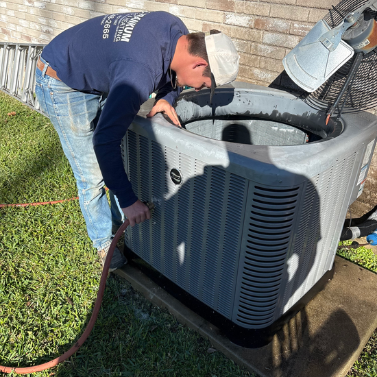 Technician diagnosing an air conditioning system.