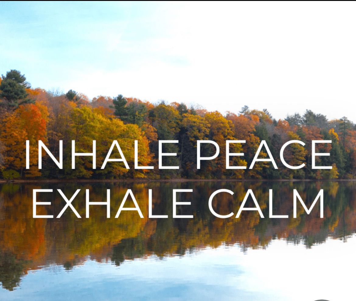 A picture of a lake with the words inhale peace exhale calm