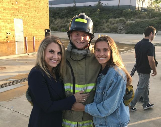 Mayor Rebecca Jones with her son and daughter at her son's Fire Fighter Academy Graduation.
