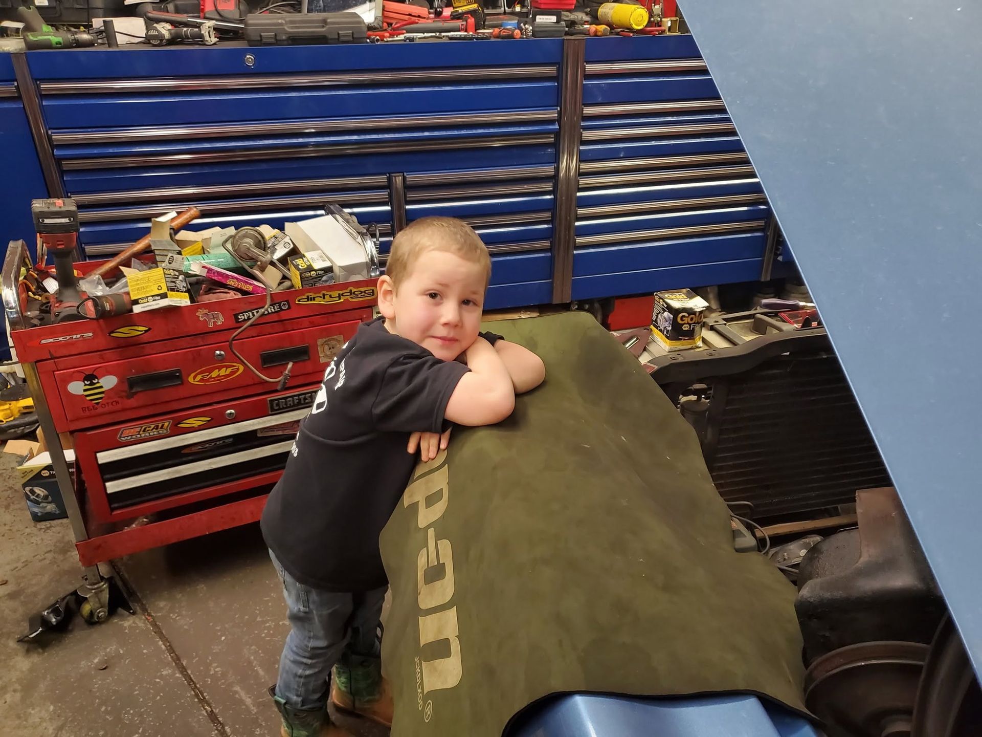 Child Standing By Shop Tool Chest | JK Auto And Truck Repair