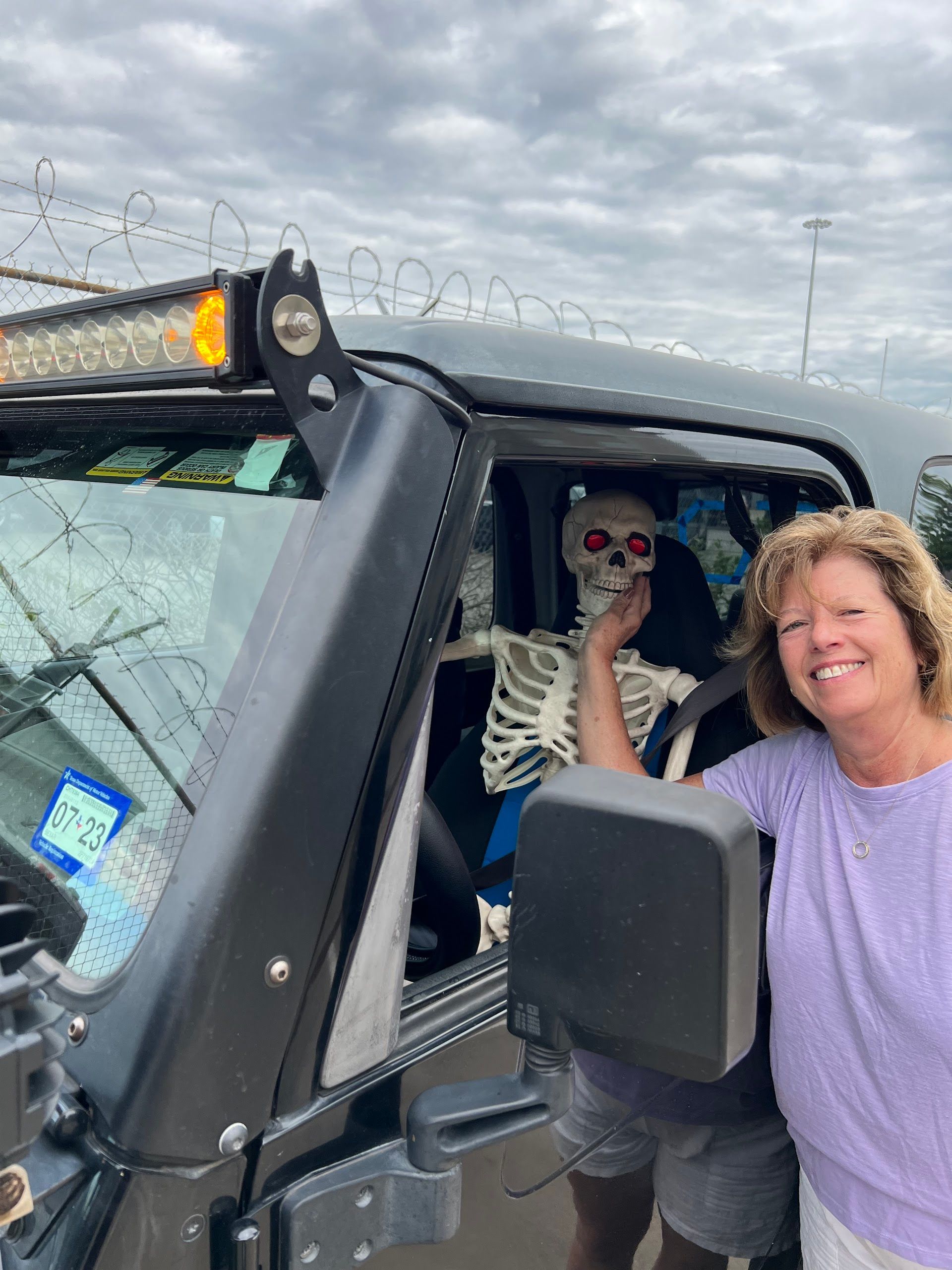 Smiling Customer Inside Jeep At Auto Shop | JK Auto And Truck Repair