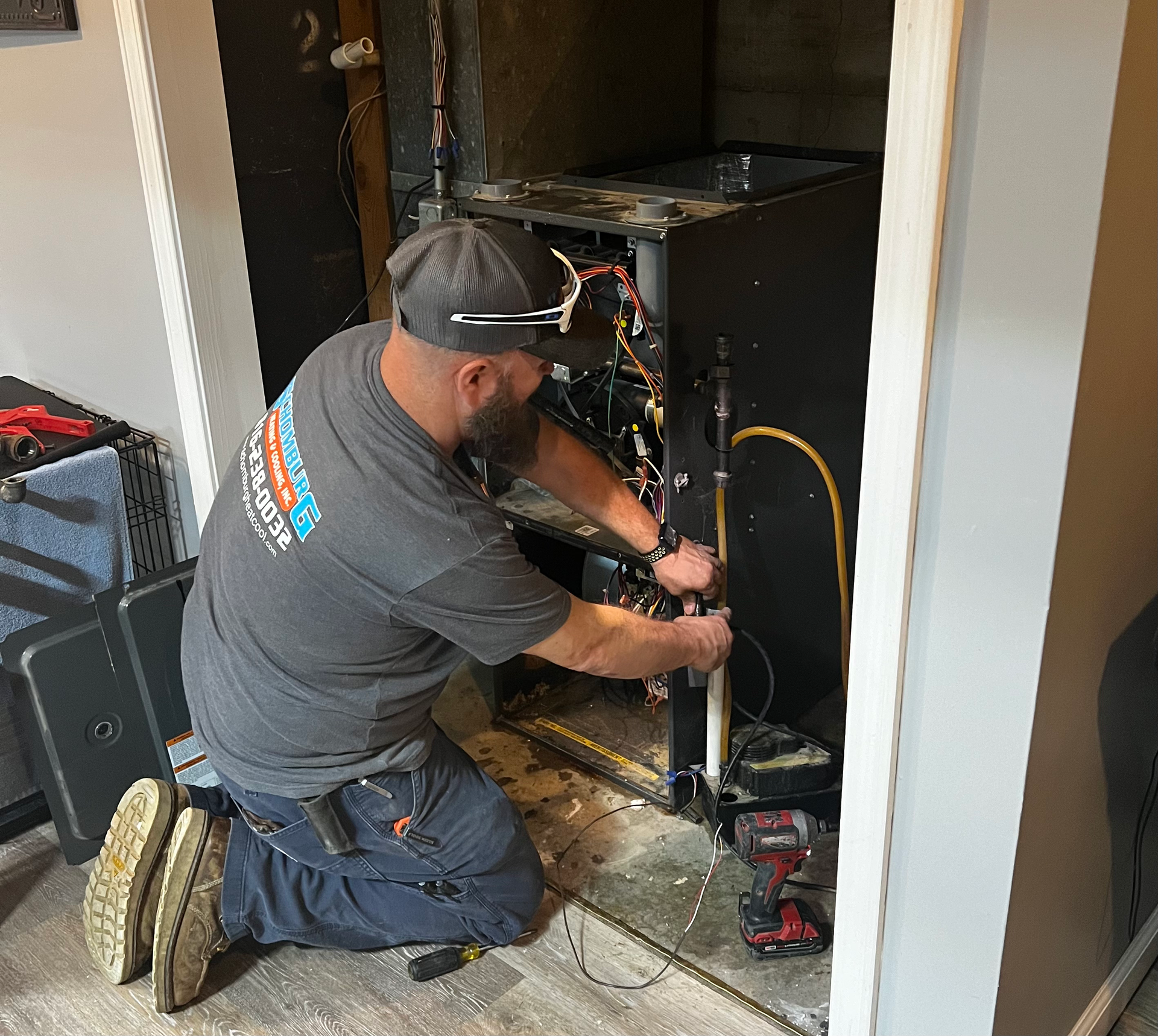 man working on a furnace