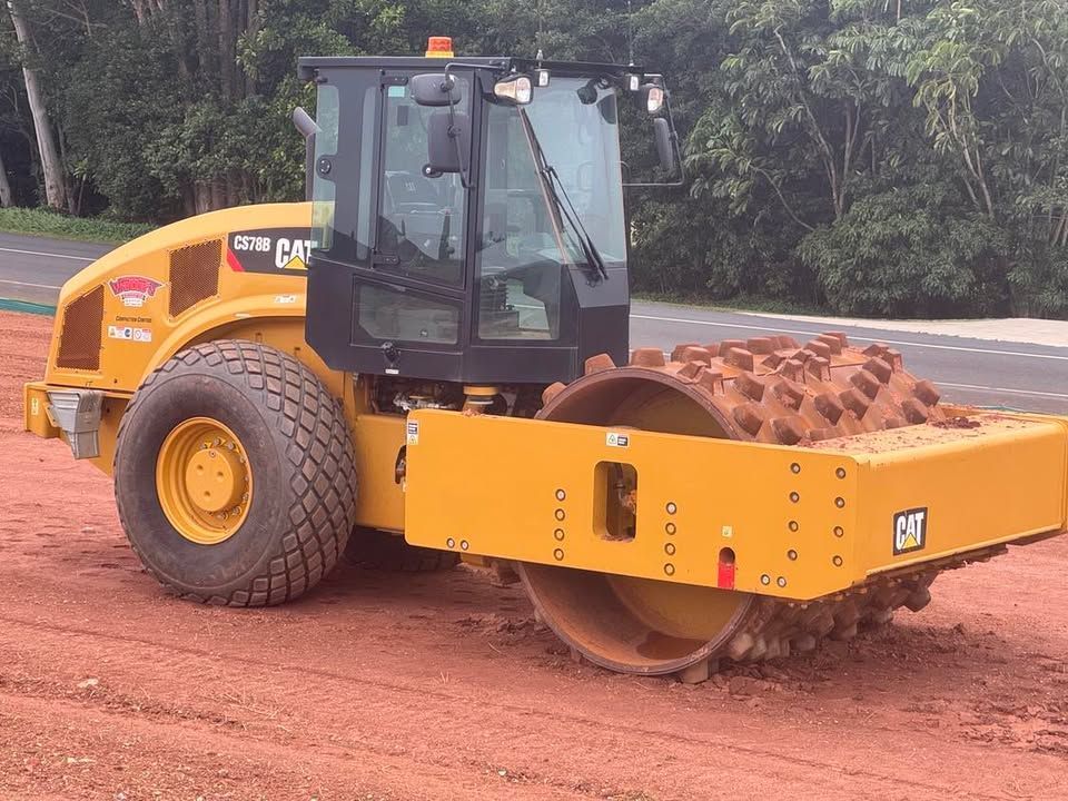 A Scaffolding Is Installed on Top of A Brick Building — Watto's Earthmoving & Machinery Hire in Atherton, QLD