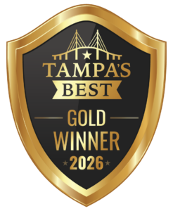 Gold shield award badge reading “Tampa’s Best Gold Winner 2026” on a black background