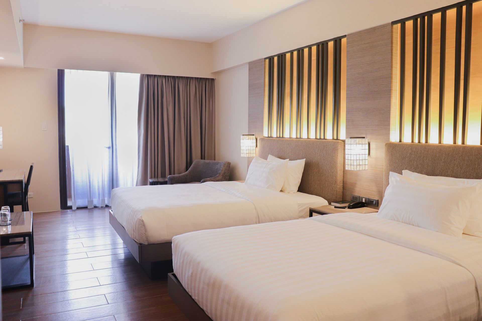 Modern twin room at The Aurora Subic Hotel with warm ambient lighting