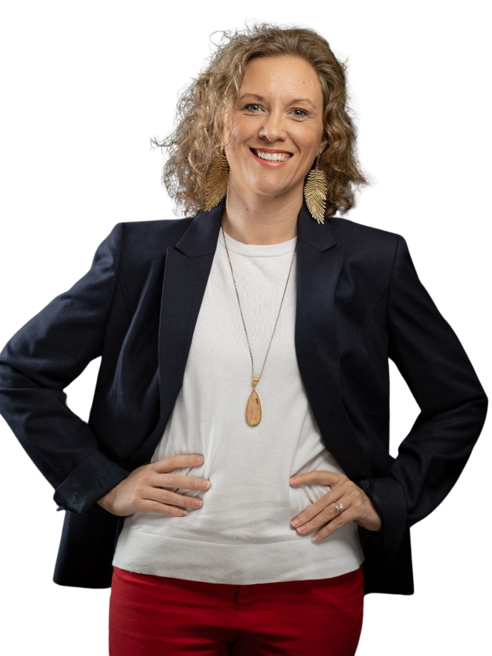 A woman in a blue shirt and black skirt is smiling for the camera.