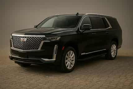 Black Cadillac Escalade SUV on a neutral background.