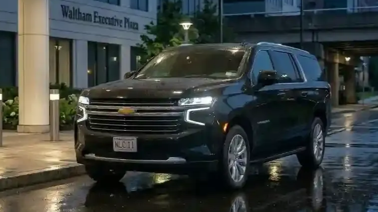 Black 2026 Chevrolet Suburban executive SUV parked in Waltham for luxury chauffeur and black car transportation service.
