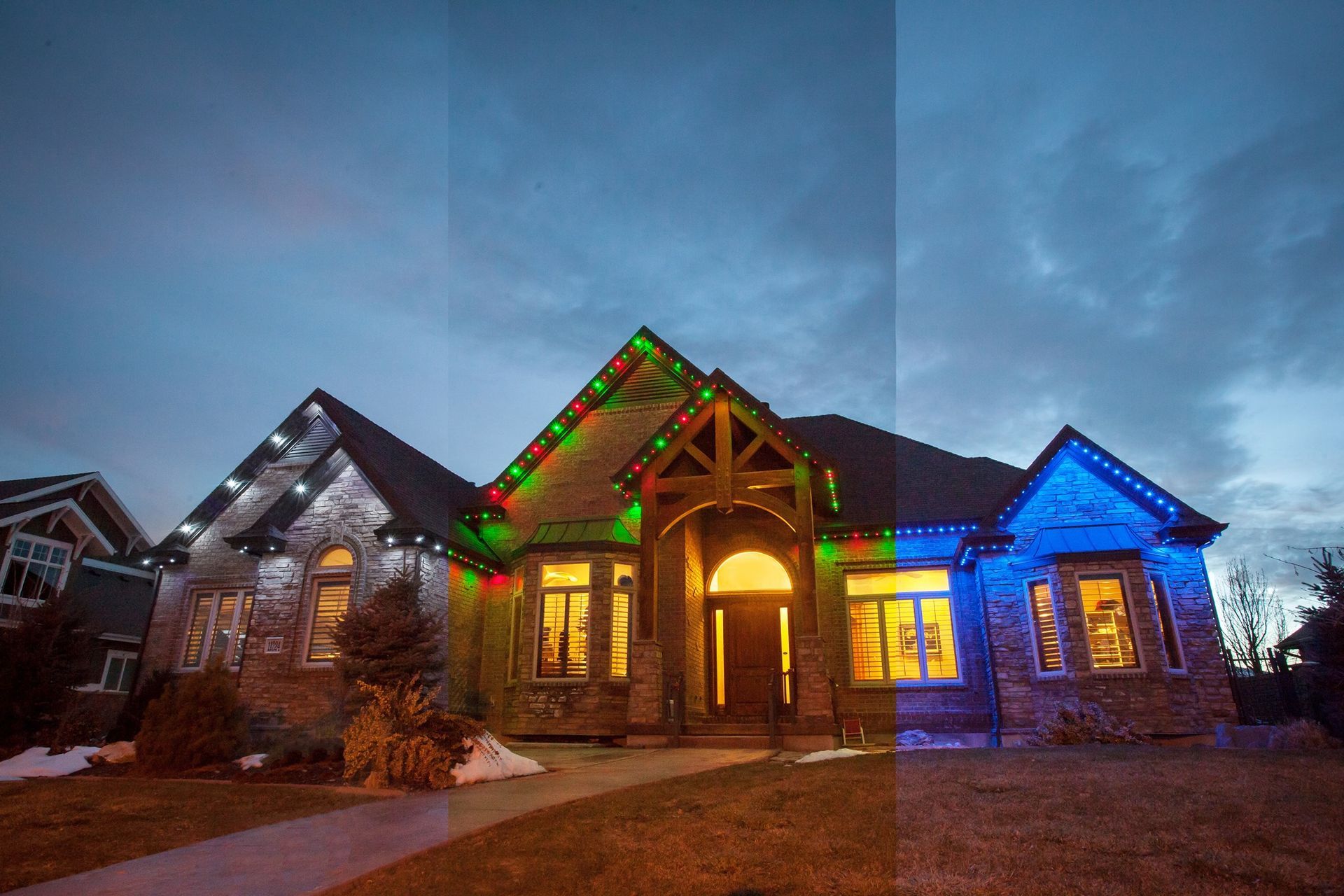 Stone house with colorful holiday lights glowing at dusk under a cloudy blue sky