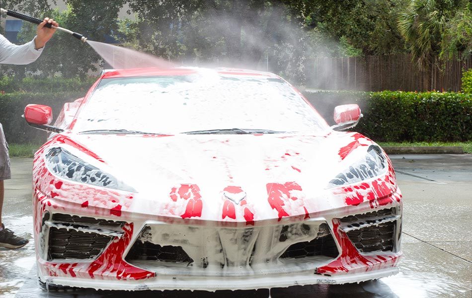 guy cleaning the ferrari
