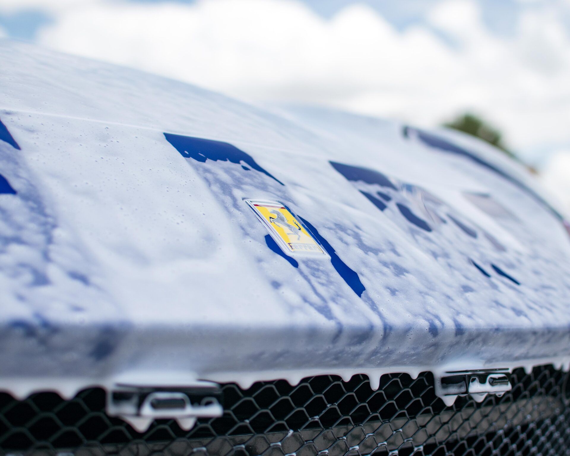 A close up of a car hood with a sticker on it